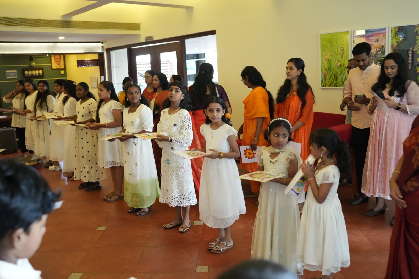 Children receiving certificates at Letude event